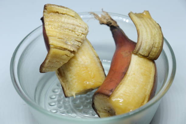 istock Bunch of fresh ripe red colour  bananas on white background 1272202487