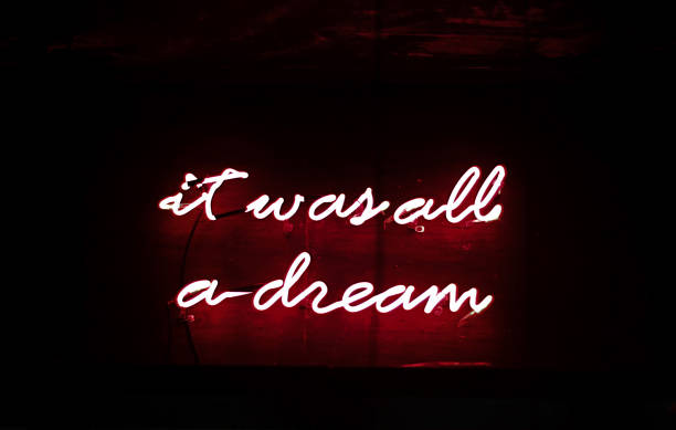 istock Neon glowing sign on the dark wall. Night frame light decoration. 1272204074
