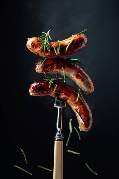 istock Steaming grilled sausages with rosemary. 1272206015