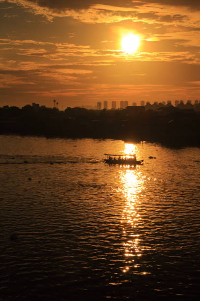 istock Sunset in and the boat in the river 1272206280