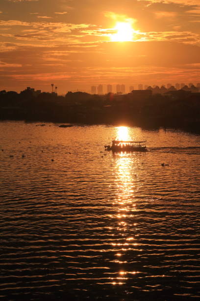 istock Sunset in and the boat in the river 1272206294