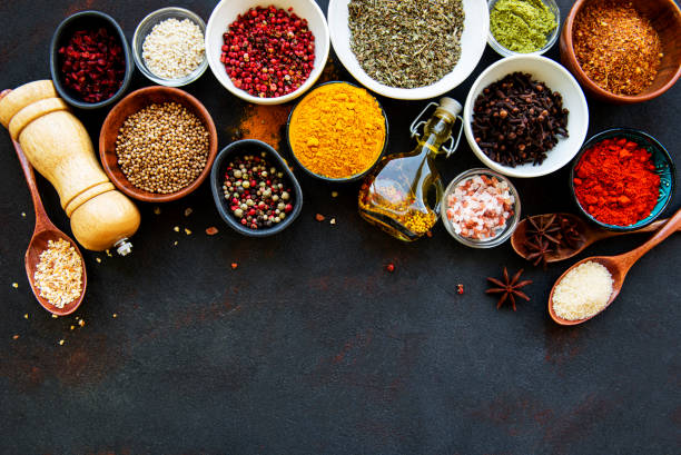istock Assortment of spices on black 1272206504