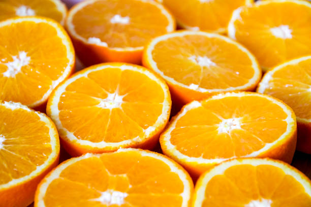 istock Bunch of fresh sliced oranges on a tray 1272207355