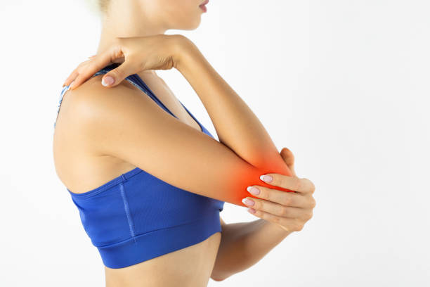 istock Woman with pain in elbow 1272207456