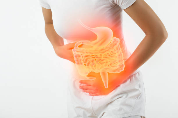 woman touching stomach - inflammation imagens e fotografias de stock