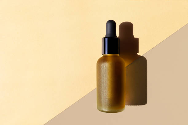 istock Mockup with copy space. Cosmetic oil bottle, beige diagonal background. 1272207614