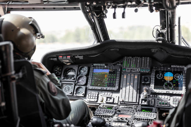 istock Army Pilot Riding Military Helicopter 1272208275