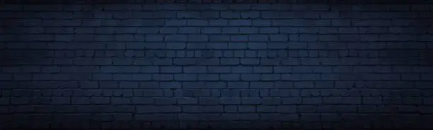 Photo of Navy blue brick wall wide texture. Dark indigo masonry large long background. Gloomy night backdrop