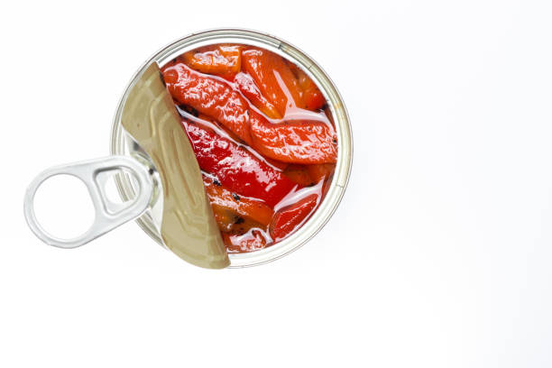 istock Canned roasted red peppers with white background 1272208351