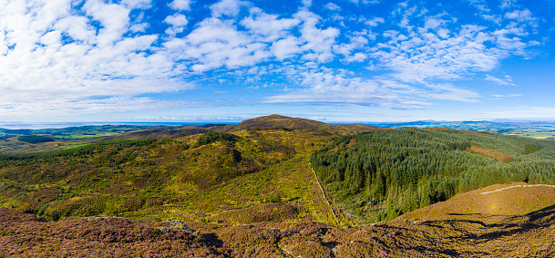 The view captured by a drone of a rural scene in south west Scotland. The panorama was created by merging several images together.