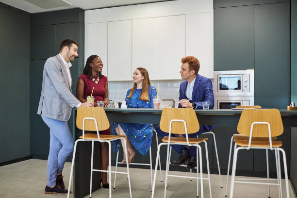 istock Cheerful business group drinking smoothies on a lunch break at work 1272216065