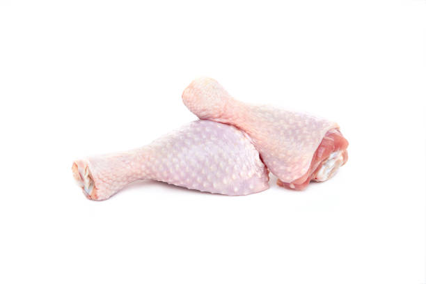 istock Two fresh raw chicken drumsticks on a white background. 1272217104