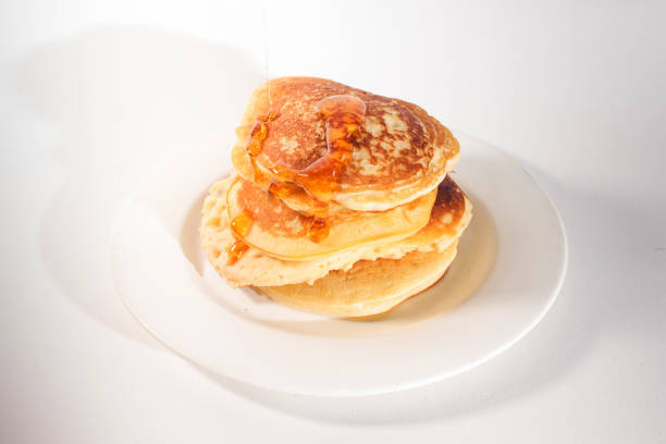 istock The pancakes are topped with honey 1272217595