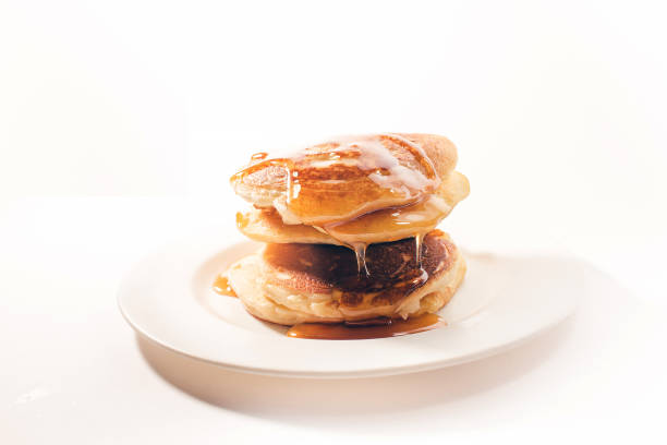 The pancakes are topped with honey