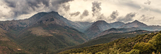 Monte Padro, Monte Grosso and Monte San Parteo in the Asco mountain range in Corsica under dark stormy skies
