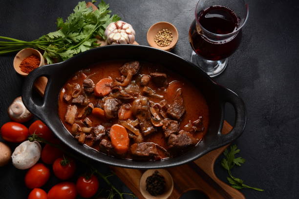 Beef Bourguignon . Beef Bourguignon . Stew with red wine ,carrots, onions, garlic, a bouquet garni, and garnished with pearl onions, mushrooms and bacon. French cuisine- regional recipe from Burgundy beef stew stock pictures, royalty-free photos & images