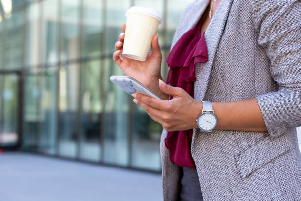 istock Business woman texting on mobile phone 1272222128