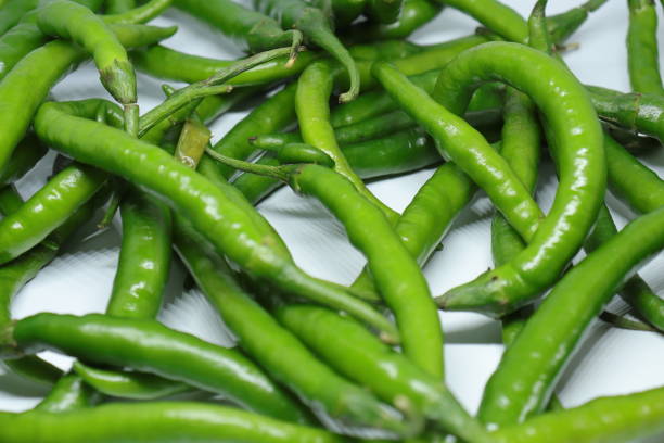 istock Green cayenne pepper with a white background 1272222178