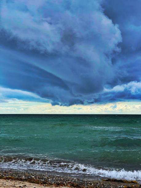istock Giant thunderstorm hits the beach 1272222297