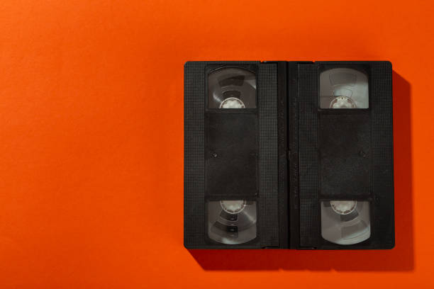 istock Videotape without a cover on an orange background. 1272223488