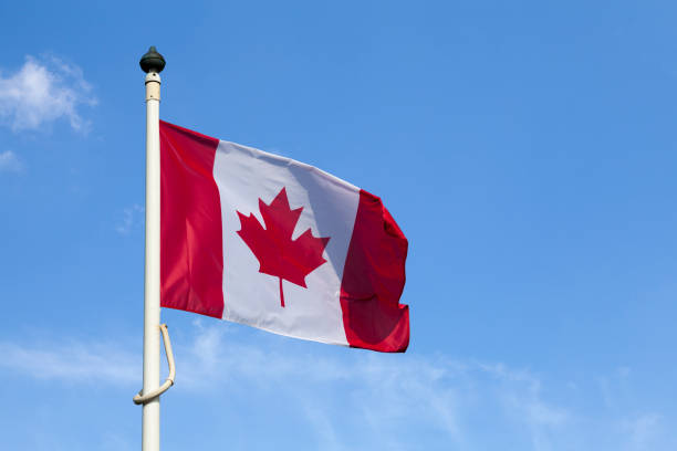 istock Canadian flag waving atop a its pole 1272223933