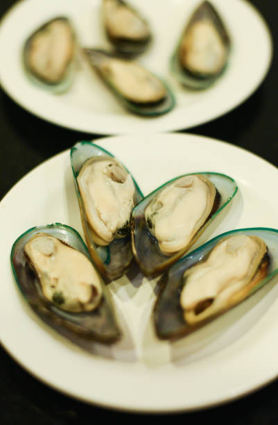 istock Fresh green mussels for BBQ in white dish 1272224865