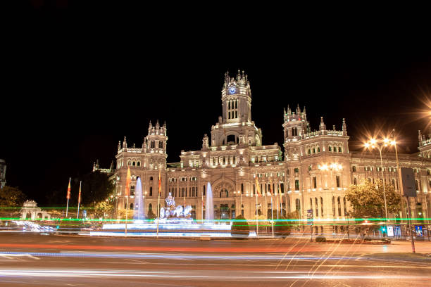 Night photography of lines of light drawn by the traffic of vehicles next to the Fuente de Cibeles and the Madrid City Council Night photography of lines of light drawn by the traffic of vehicles next to the Fuente de Cibeles and the Madrid City Council lightpainting stock pictures, royalty-free photos & images