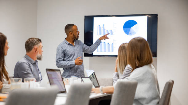 Businessman giving presentation with colleagues