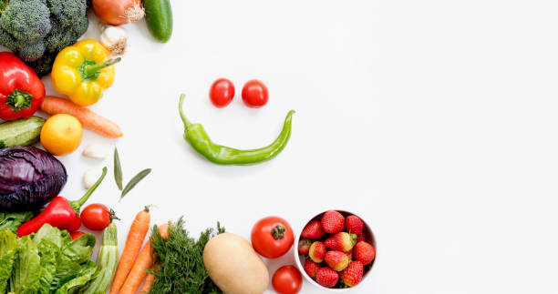istock Organic fresh vegetables and fruits frame on white background, top view, copy space 1272229709