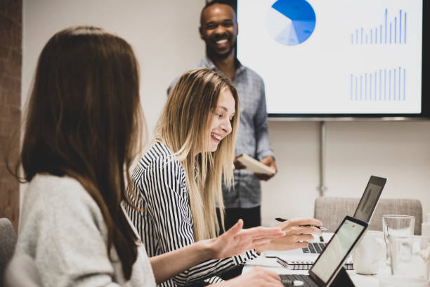 istock Businessman giving presentation with colleagues 1272229717
