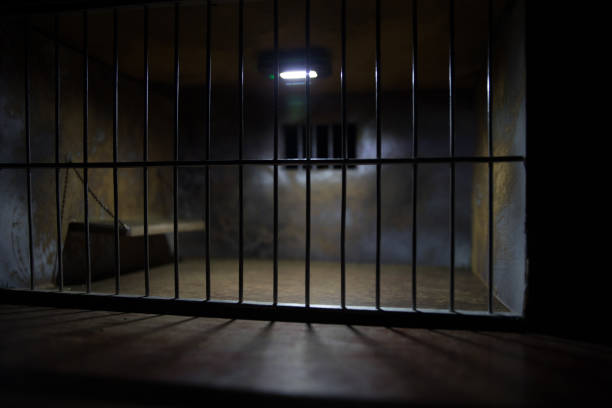 istock Jail or prison cell. Old grunge prison miniature. Dark prison interior creative decoration. Empty cell. Selective focus Obsolete gray grunge concrete room. 1272231453