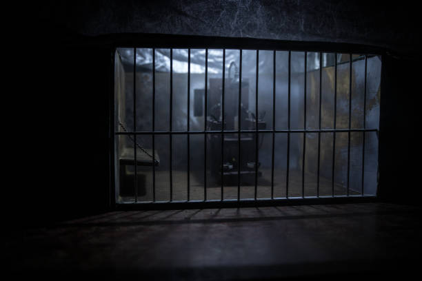 istock Jail or prison cell. Obsolete gray grunge concrete room. Old prison miniature. Execution concept 1272231455