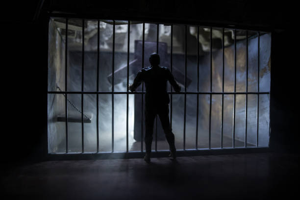 istock Old prison bars cell lock. Creative artwork decoration. Old grunge prison interior. 1272231460