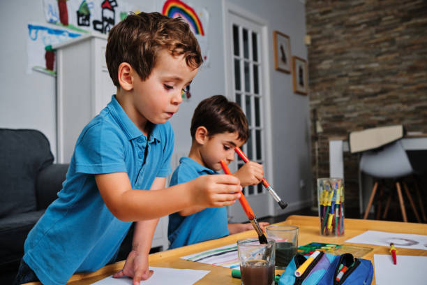 istock young boys playing with colors and drawing 1272232975
