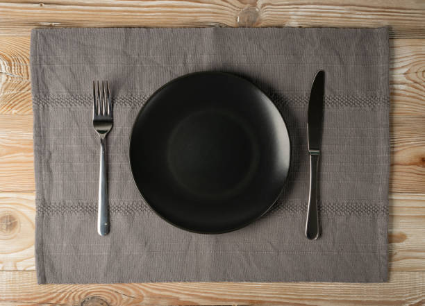 istock Empty Plate on White Wooden Table Top View with Copy Space 1272233153