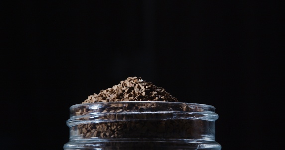 Instant coffee granules in the jar. Extreme close-up