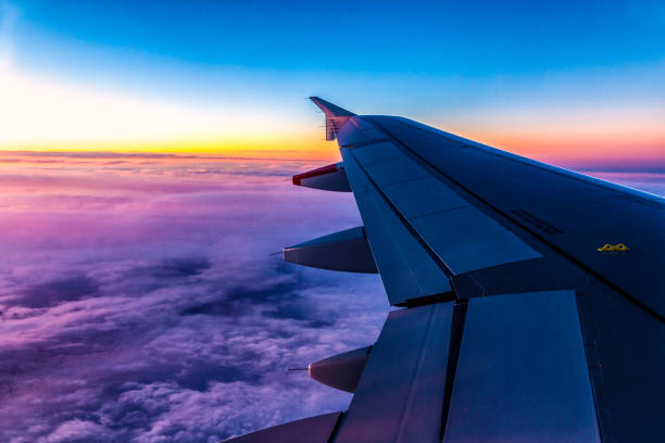 istock Sunrise or sunset looking through a window flying on an airplane 1272238860