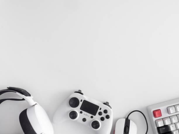 istock gamer work space concept, top view a gaming gear, mouse, keyboard, joystick, headset, mobile joystick, in ear headphone and mouse pad on black table background. 1272238865