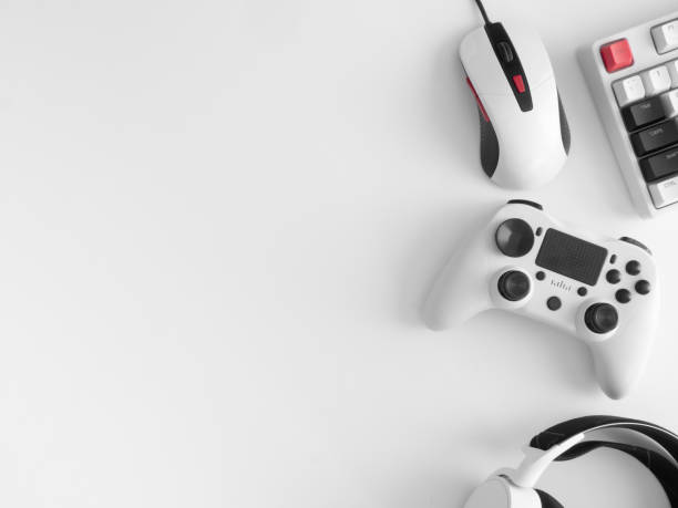 istock gamer work space concept, top view a gaming gear, mouse, keyboard, joystick, headset, mobile joystick, in ear headphone and mouse pad on black table background. 1272238870