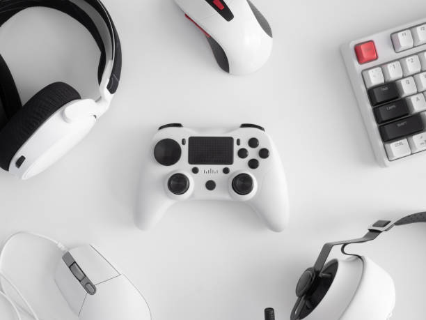 istock gamer work space concept, top view a gaming gear, mouse, keyboard, joystick, headset, mobile joystick, in ear headphone and mouse pad on black table background. 1272238872
