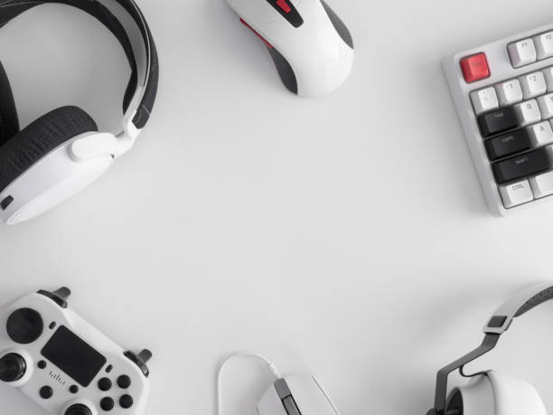 istock gamer work space concept, top view a gaming gear, mouse, keyboard, joystick, headset, mobile joystick, in ear headphone and mouse pad on black table background. 1272238875