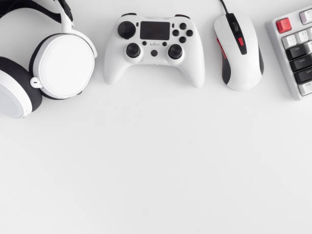 istock gamer work space concept, top view a gaming gear, mouse, keyboard, joystick, headset, mobile joystick, in ear headphone and mouse pad on black table background. 1272238879