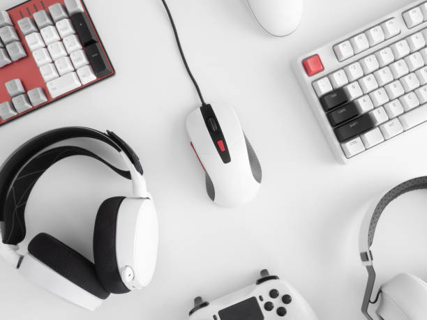 istock gamer work space concept, top view a gaming gear, mouse, keyboard, joystick, headset, mobile joystick, in ear headphone and mouse pad on black table background. 1272238886
