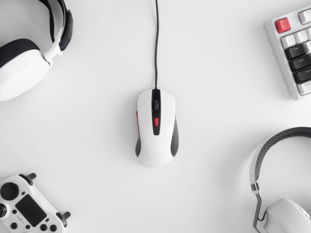 istock gamer work space concept, top view a gaming gear, mouse, keyboard, joystick, headset, mobile joystick, in ear headphone and mouse pad on black table background. 1272238889