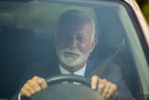 istock Businessman driving car 1272240273