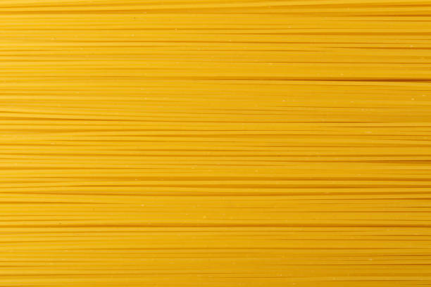 istock Raw Yellow Spaghetti, Dry Long Italian Pasta 1272242142
