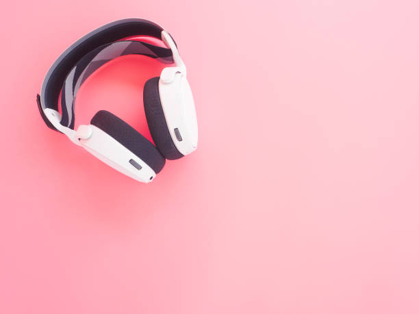 istock music headphones on pink background. 1272246717