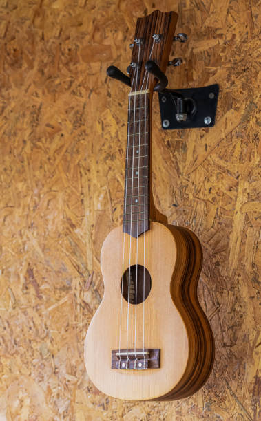 istock A small guitar hanging on the wall 1272249360