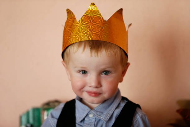 istock Funny little boy in the crown. 1272249637