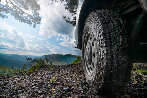 mountain top view, landscape and sky, driving a four-wheel drive car through the hills. beauty of Siberian nature 4 wd.